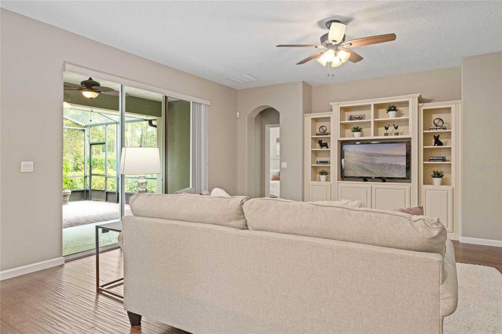 View of Great Room &amp; the 22' x 22'6" screen enclosed covered patio w/ brick pavers