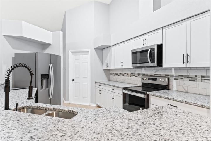 Modern Kitchen with New appliances, Highend Cabinets & Granite Counter tops
