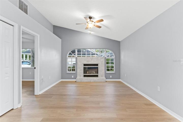 Formal Living Area With Fire Place & Front Window Exposure