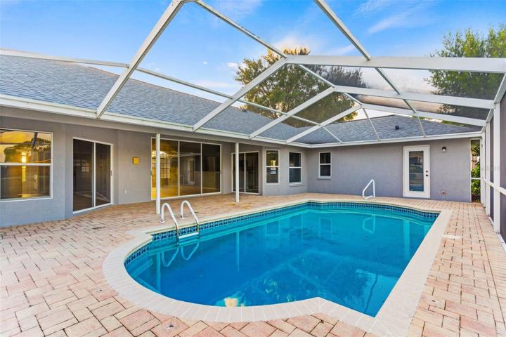 Paver Exterior Patio With Large Screen Enclosure & Pool