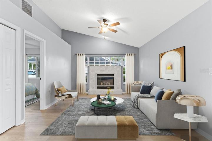 *Virtually Staged* Formal Living Area with Fireplace & Vaulted ceilings, Front Window exposure