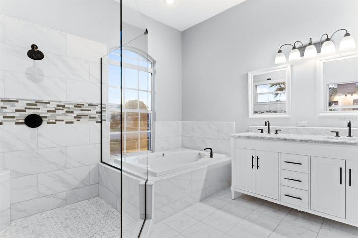 Master Bathroom with Tile Shower, Glass Shower, Glass Door & Spa.  High-end Cabinets & Granite Counter tops