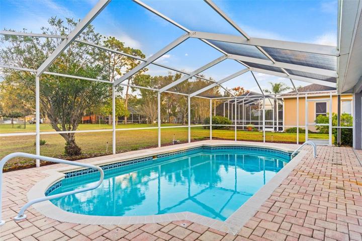 Paver Exterior Patio With Large Screen Enclosure & Pool