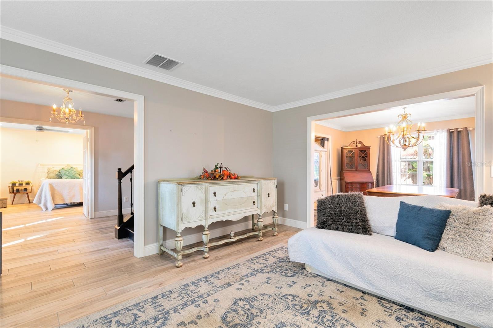 View from formal living room into foyer and foyer dining room.