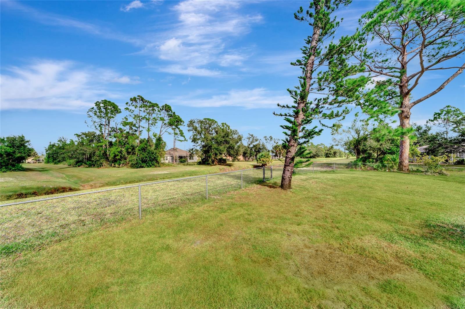 Fenced with greenbelt privacy and view.