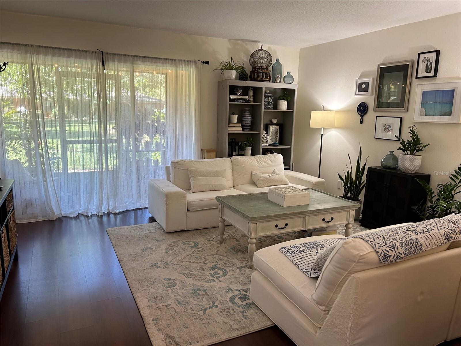 Living area with patio beyond.