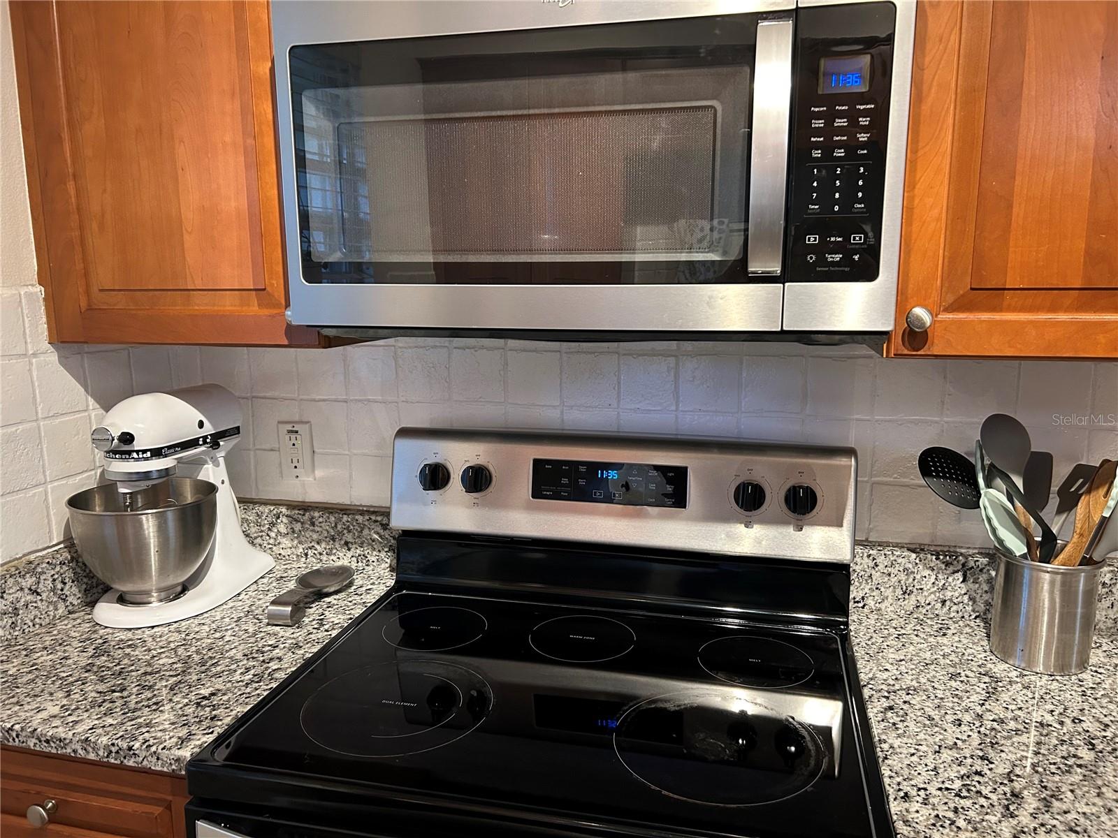 Kitchen with granite counters.