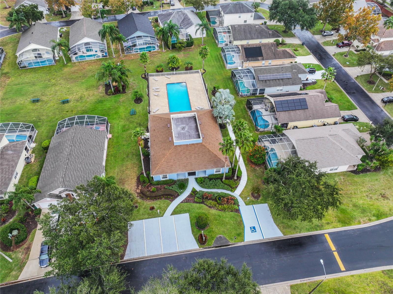 Community center with clubhouse, fitness center, library, and pool