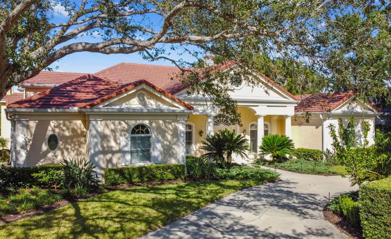 Front of the property; The 3 car garage is to the left facing the side neighbor's lot.
