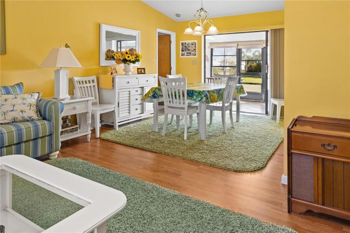 Another view of the Dining Room.  Note that it opens onto an enclosed Lanai and offers more space for entertaining.