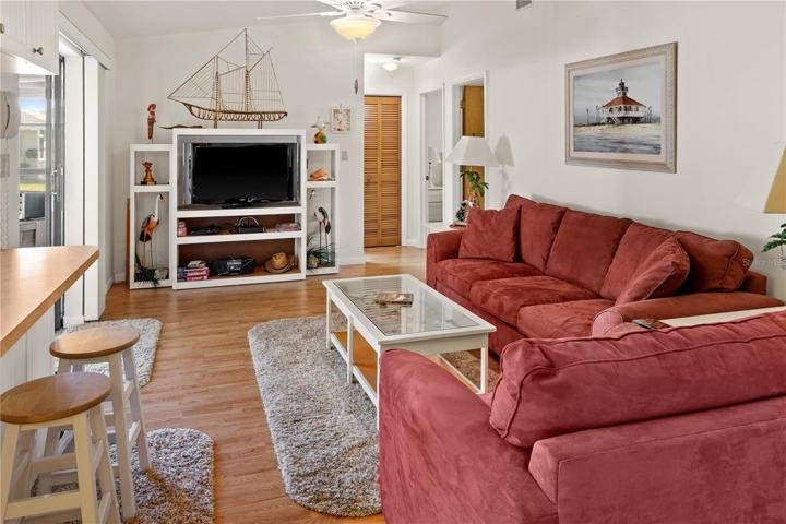 The Family Room has a pass-through counter to the Kitchen.  The hallway behind it leads to two bedrooms that are separated from the main home.