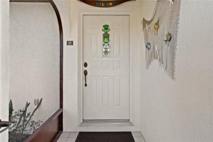A screened entryway leads directly into the home.