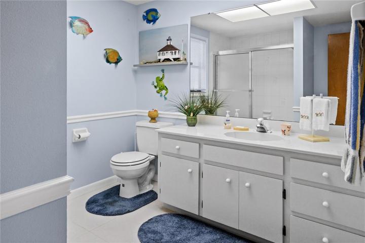 There is a bathroom between Bedrooms 2 and 3.