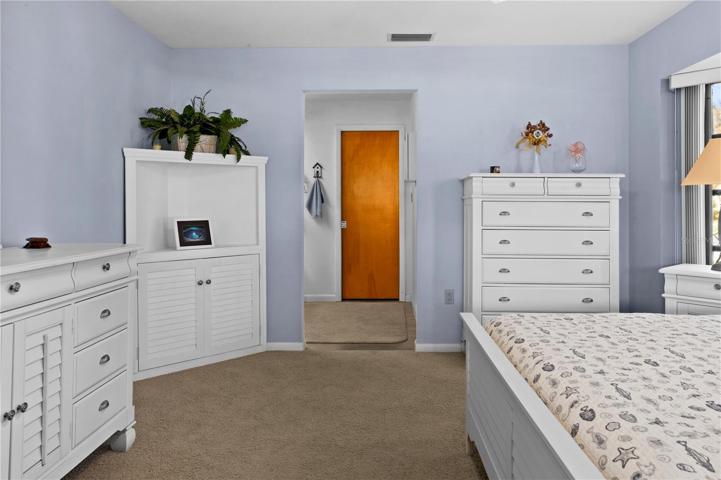 Additional view of Owner's Suite peering into the dressing area.