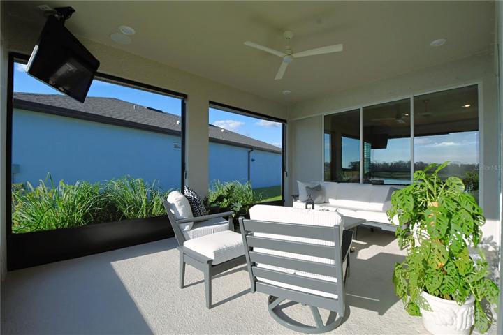 A ceiling fan on the screened in back porch makes for year round comfort and enjoyment.