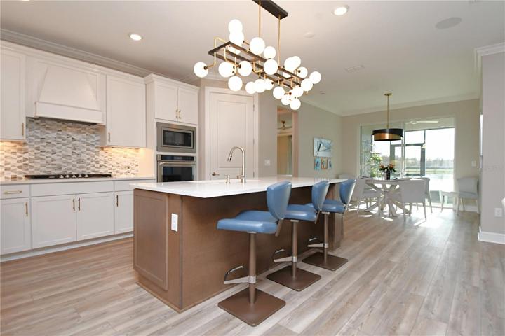 The kitchen offers 'cafe' seating for your dining table, with a water view.