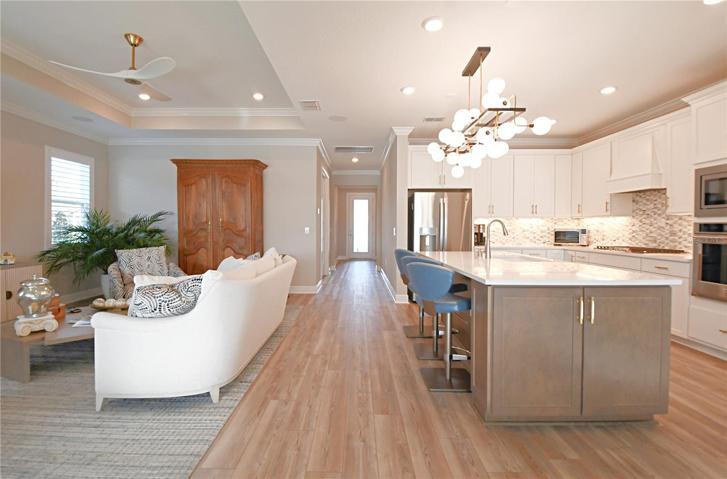 The kitchen and breakfast bar open to the great room.
