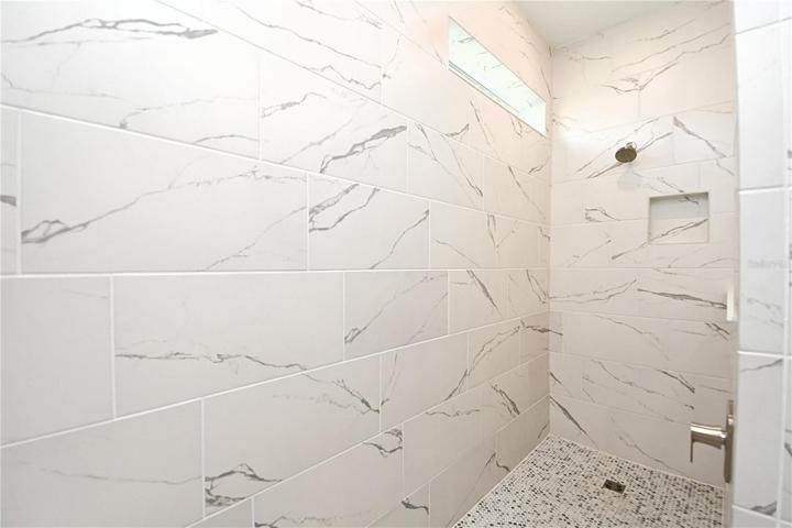 Stunning tiles work in the primary ensuite.