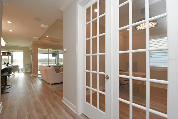 Elevated 9-foot ceilings crown the space, drawing eyes upward, while the 3-way split layout unfolds with elegance, adorned with crown molding and recessed lighting. The neutral color palette whispers timeless style, harmonizing with upgrades at every turn.