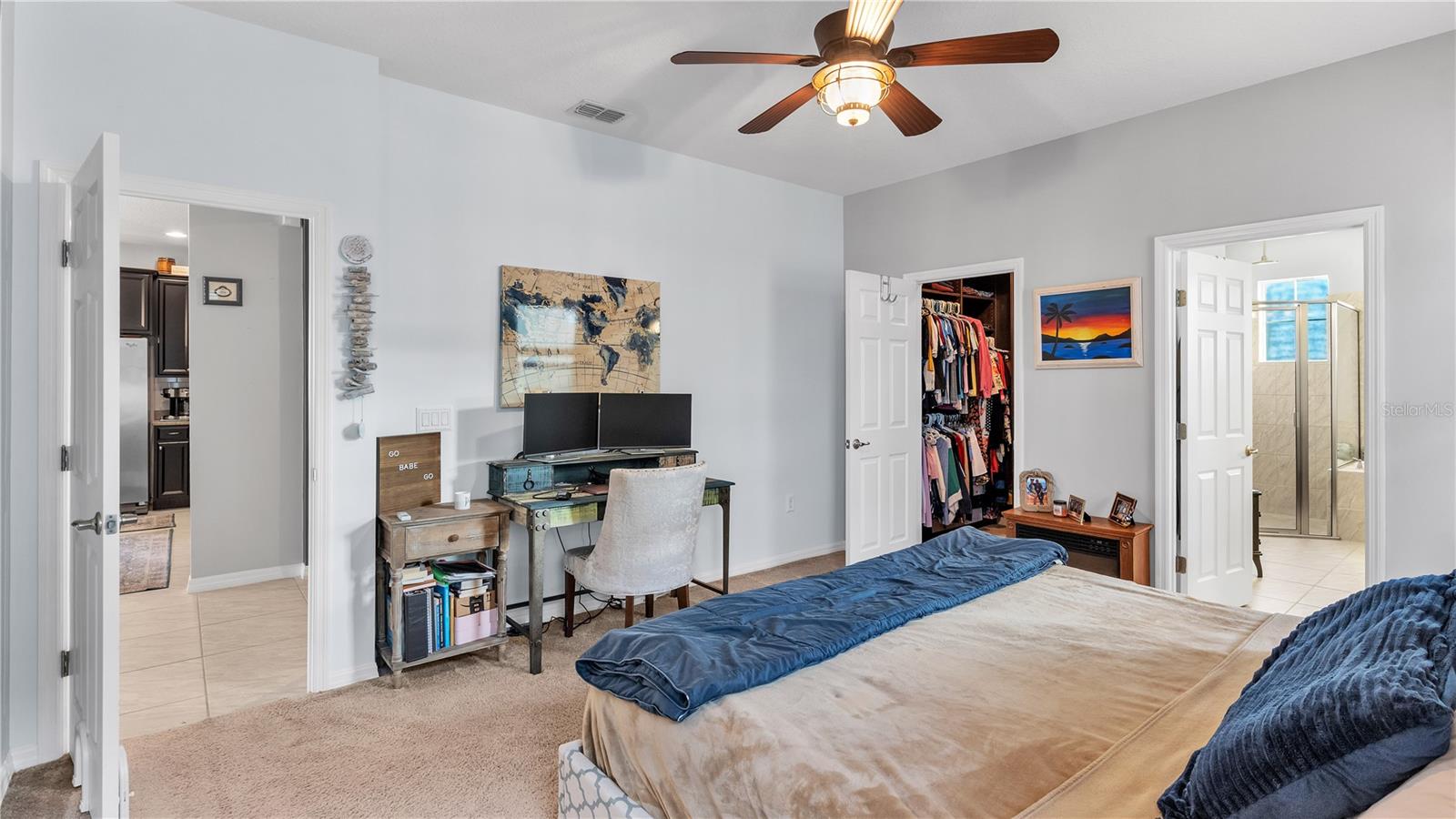 The private master suite features a large bedroom and includes a private ensuite bathroom with upgraded taller double vanities, soaking tub, and spacious walk-in shower, linen closet, and a separate toilet room.