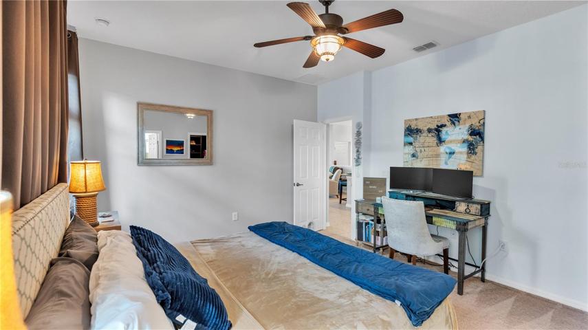 The private master suite features a large bedroom and includes a private ensuite bathroom with upgraded taller double vanities, soaking tub, and spacious walk-in shower, linen closet, and a separate toilet room.