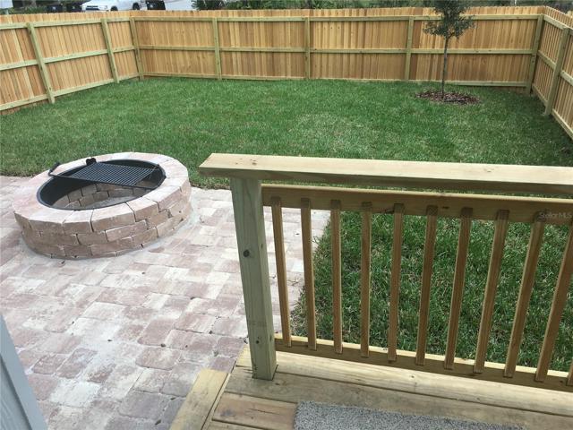 FANTASTIC LARGE FENCED YARD WITH FIRE PIT!