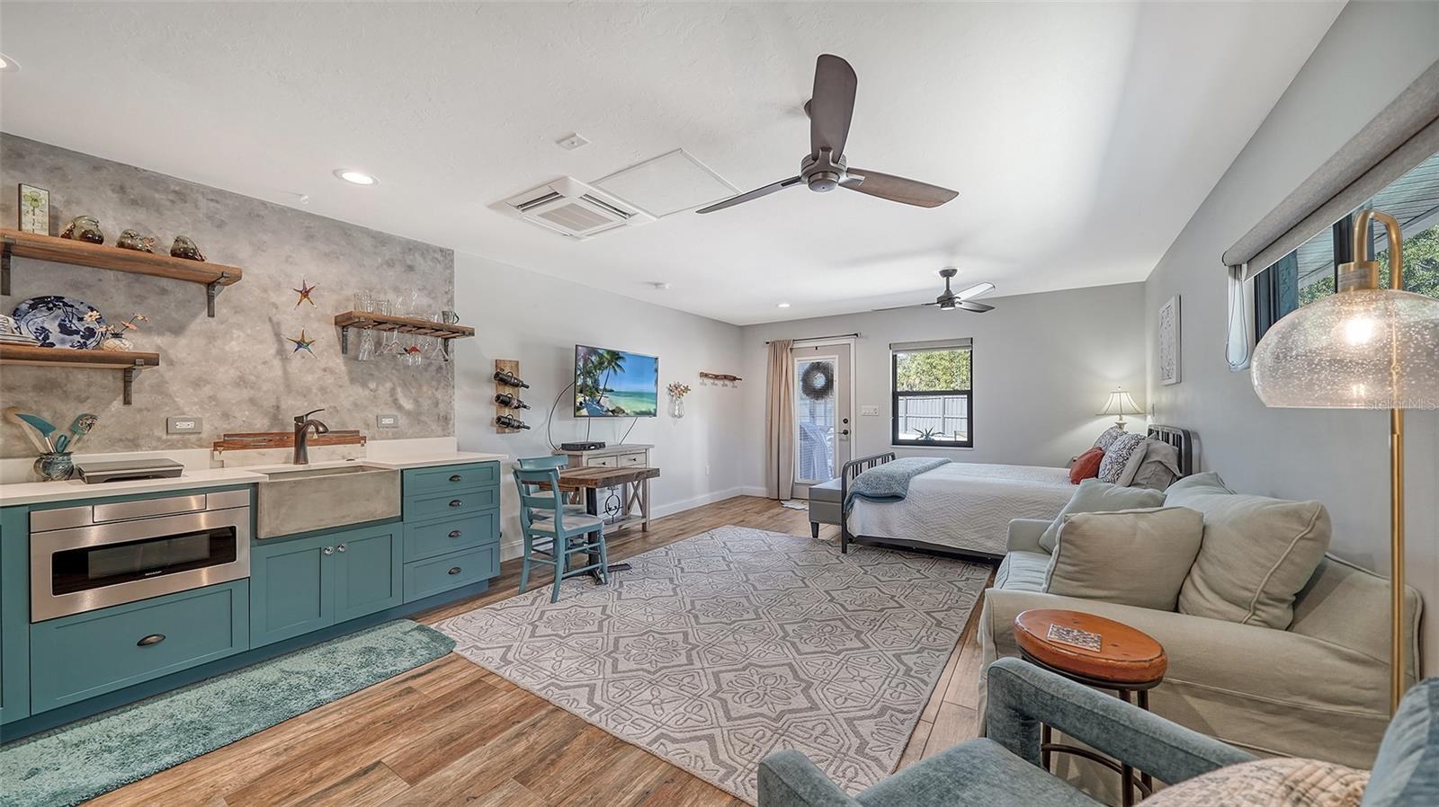 Kitchenette with dining and sitting area in guest suite