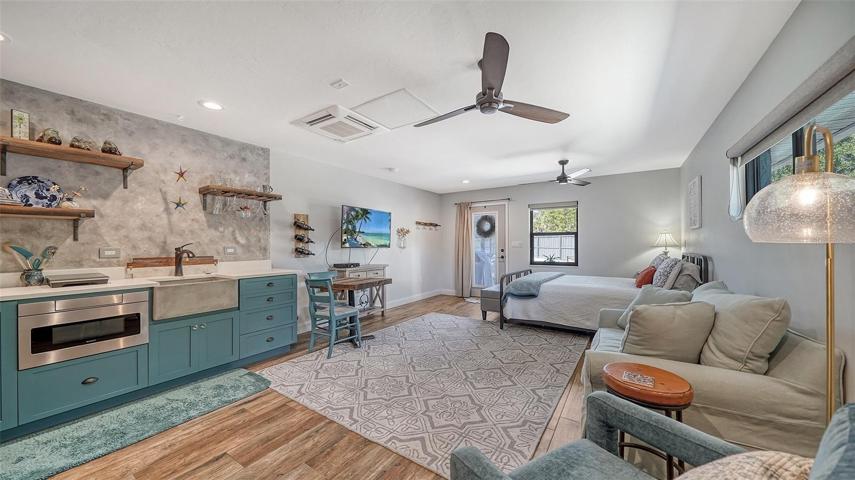 Kitchenette with dining and sitting area in guest suite