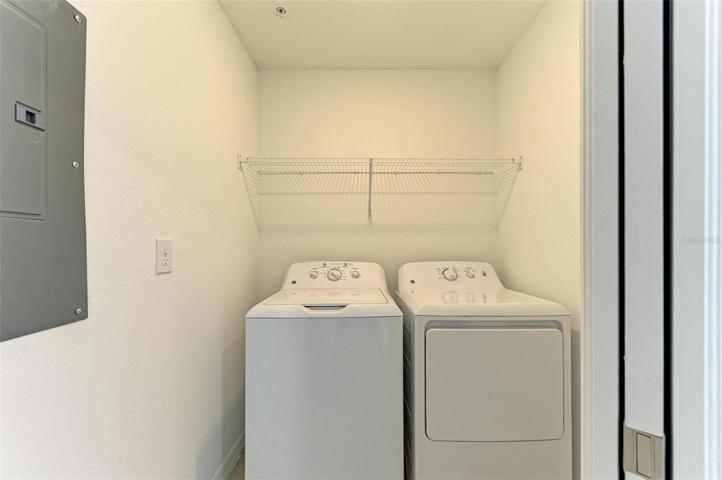 Brand new washer/dryer in laundry room with pocket door