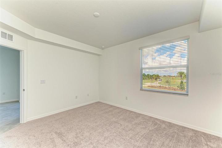 Tray ceiling in master with views of the 1st & 10th holes.