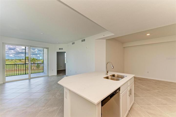 Kitchen island with room for bar stools with a premium view