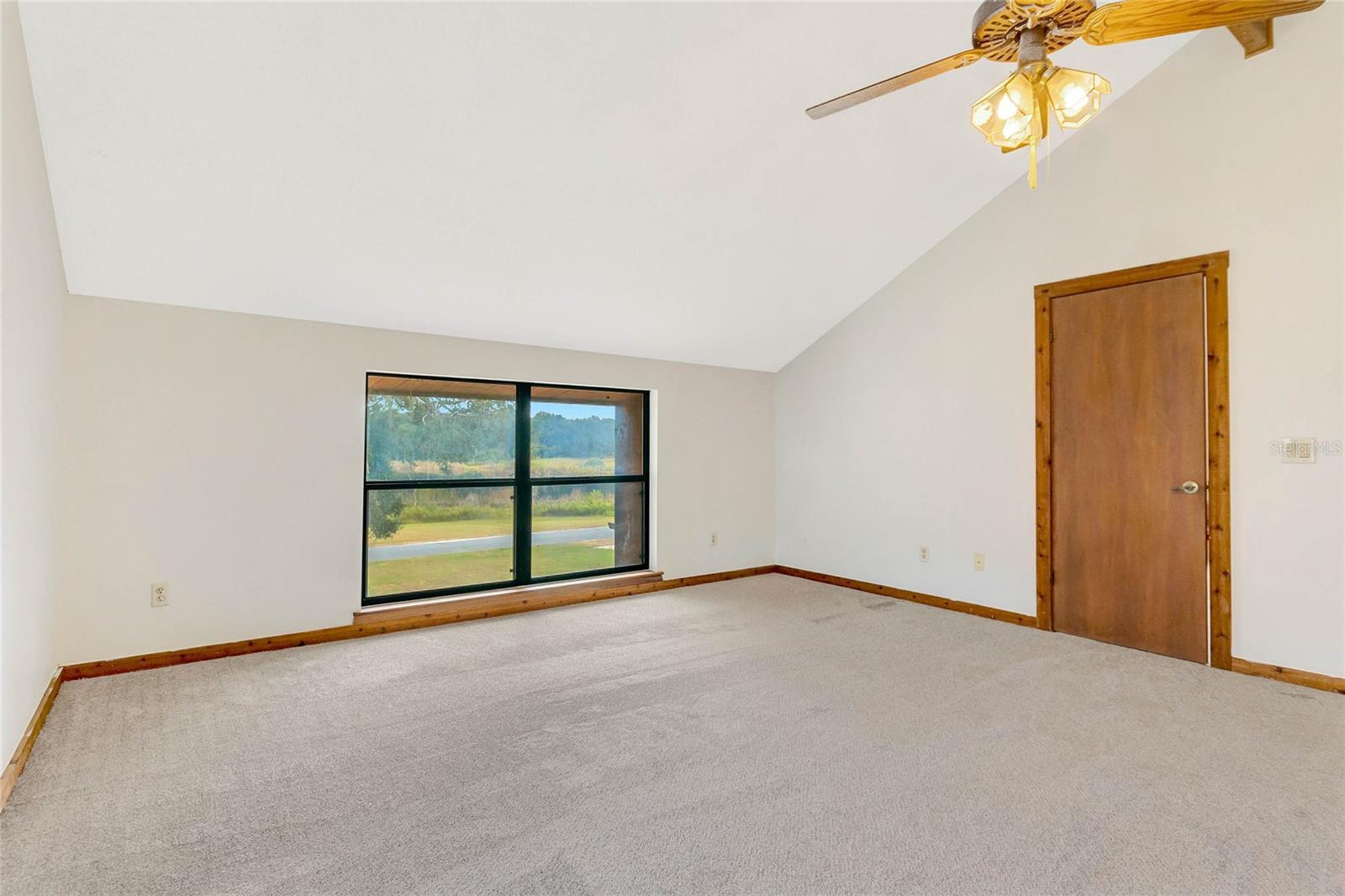 Your upstairs primary bedroom with view of the lake!