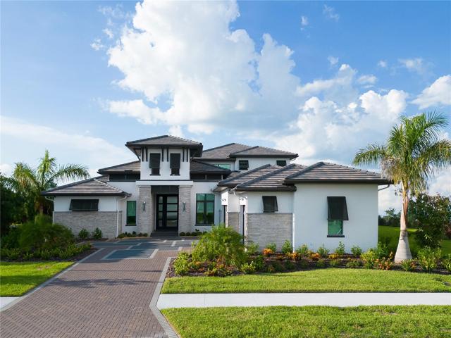 Note: This is a previosly built home. The home in this listing will have a concrete driveway (not pavers) and a shingle roof (not tile). Those options are available at an extra cost.