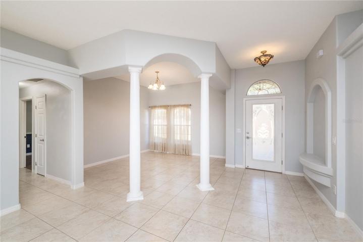 Foyer, flex space, hallway to 2nd and 3rd bedrooms