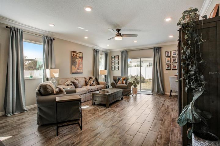 Great Room with Large Windows and Sliding Door to Back Yard