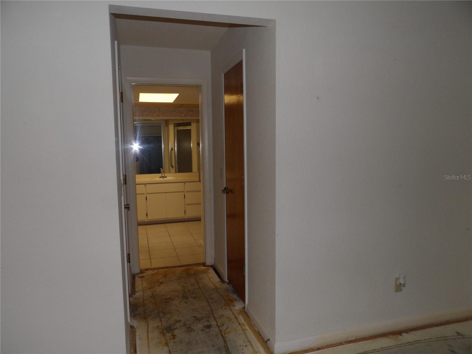 Double closets master bedroom looking into bathroom