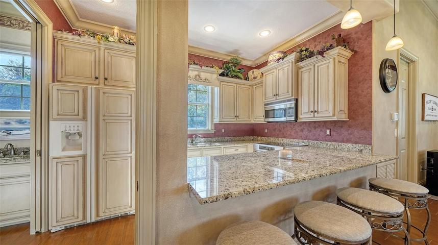 Additional full kitchen in the recreation room.
