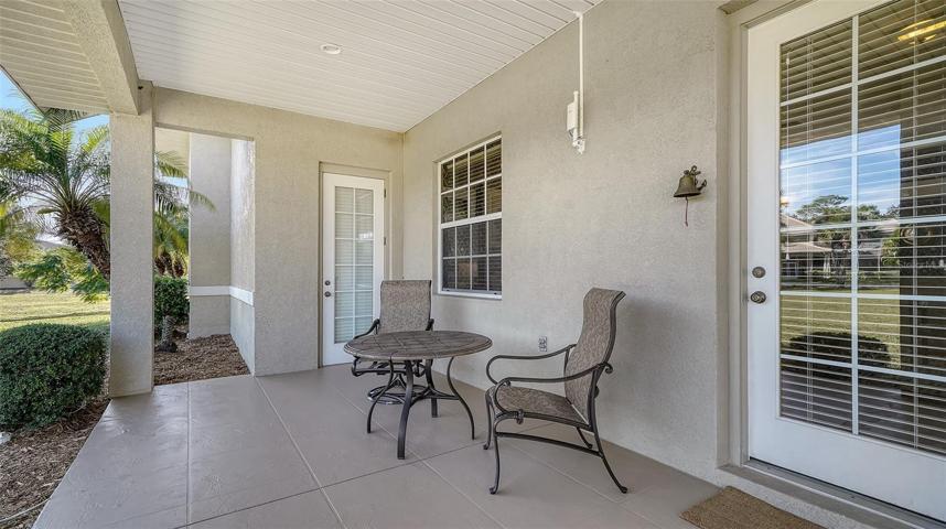Guest cottage with a large covered sitting area.