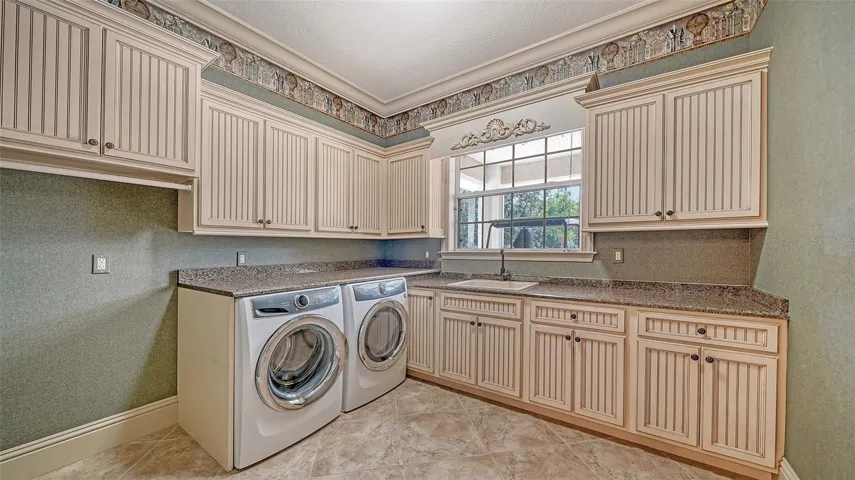 Large laundry room with ample storage.