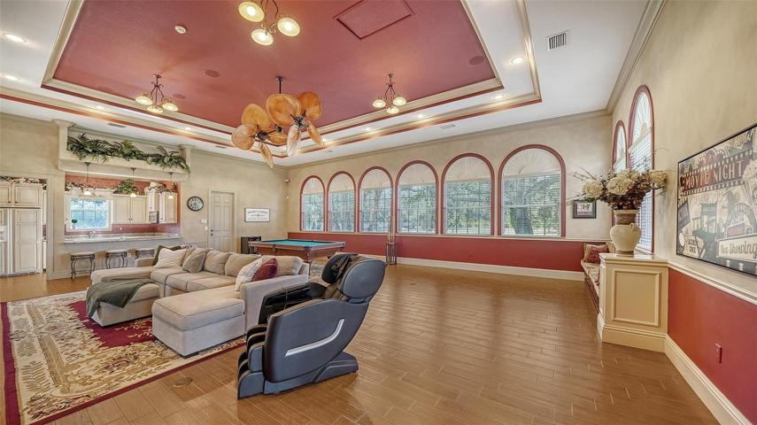 The 1,000+ sf recreational room which can accommodate multiple game tables with a dedicated full kitchen and full bath.