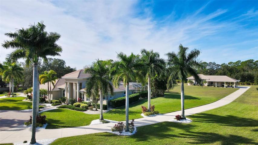 The tranquil 5+ acre park-like setting is the backdrop for your 6720 sf custom built estate.