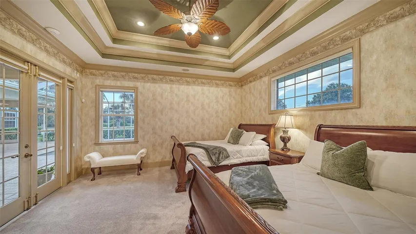 The owner's suite with serene views, French doors to the terrace, and sitting area.