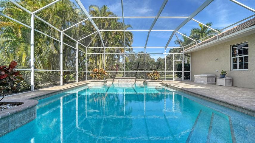 The huge 1200+ sf lanai with heated saltwater pool.