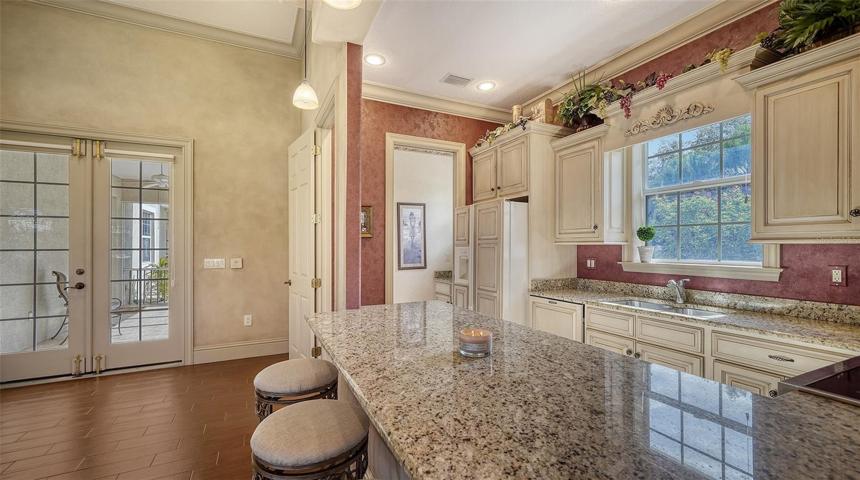 Recreation room kitchen with breakfast bar.