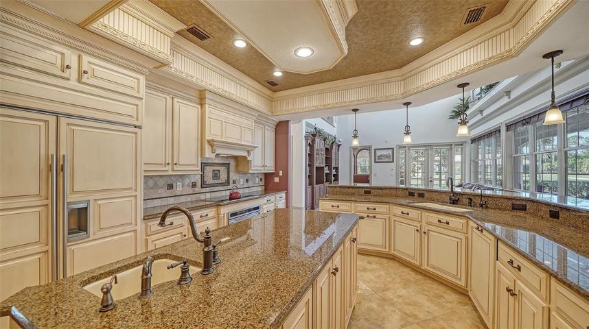 The deluxe chef’s kitchen with state-of-the-art Wolf & Subzero stainless appliances including dual ovens and warming drawer.