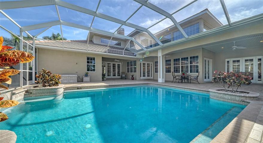 The huge 1200+ sf lanai with heated saltwater pool.
