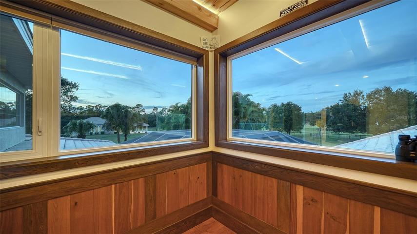 Upper level private office with wood beamed ceiling.