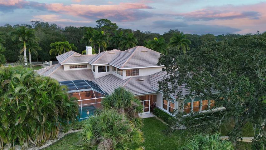 The estate is surrounded by beautiful natural landscaping.