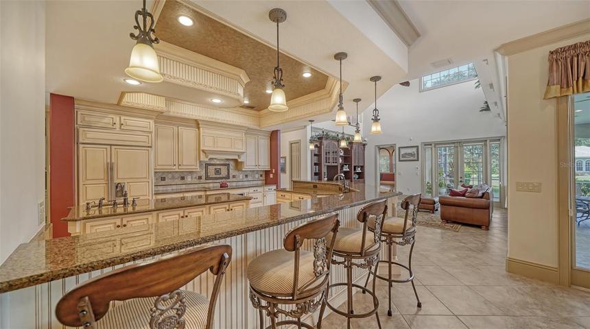 The deluxe chef’s kitchen with spacious L-shaped island and breakfast bar.