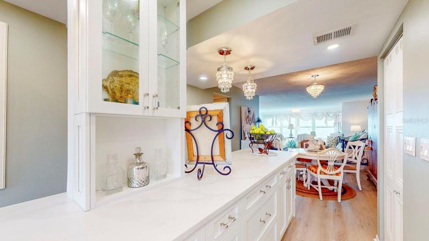 Island helps to open up the main entrance and kitchen to the living and dining area.